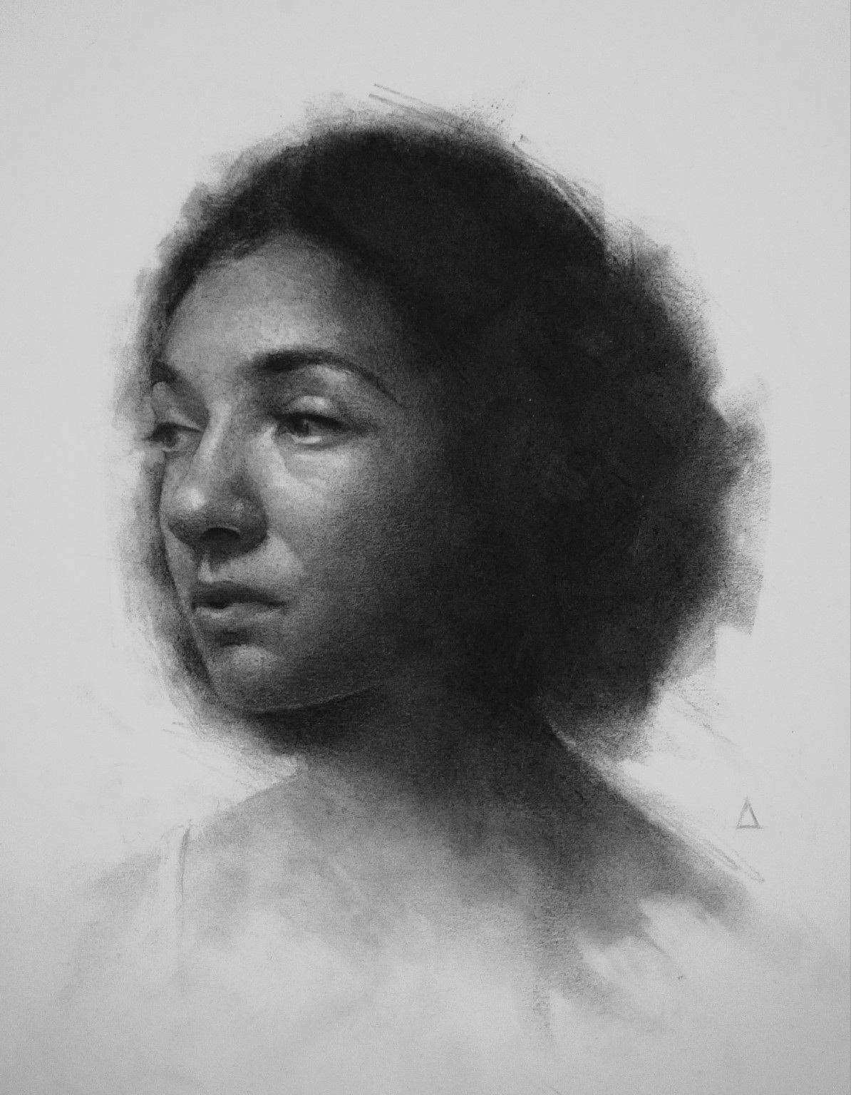 Graphite portrait of a dark-haired woman in three-quarter view