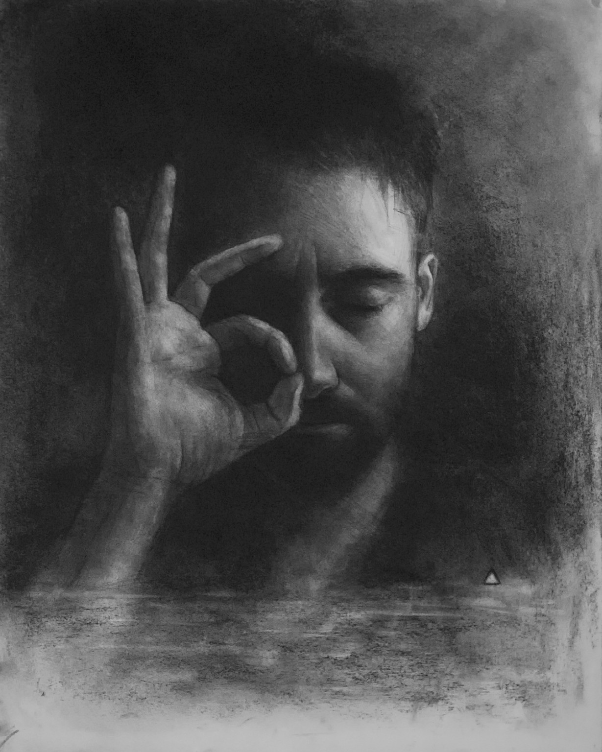 Graphite portrait framed by a hand making a circle