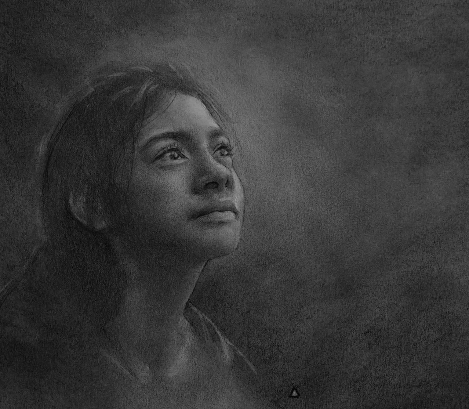 Graphite portrait of a young person wearing headphones